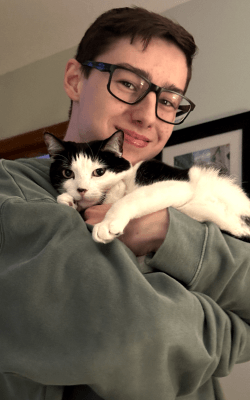 Nathan Parker hugging Windy (Nathan's Cat)